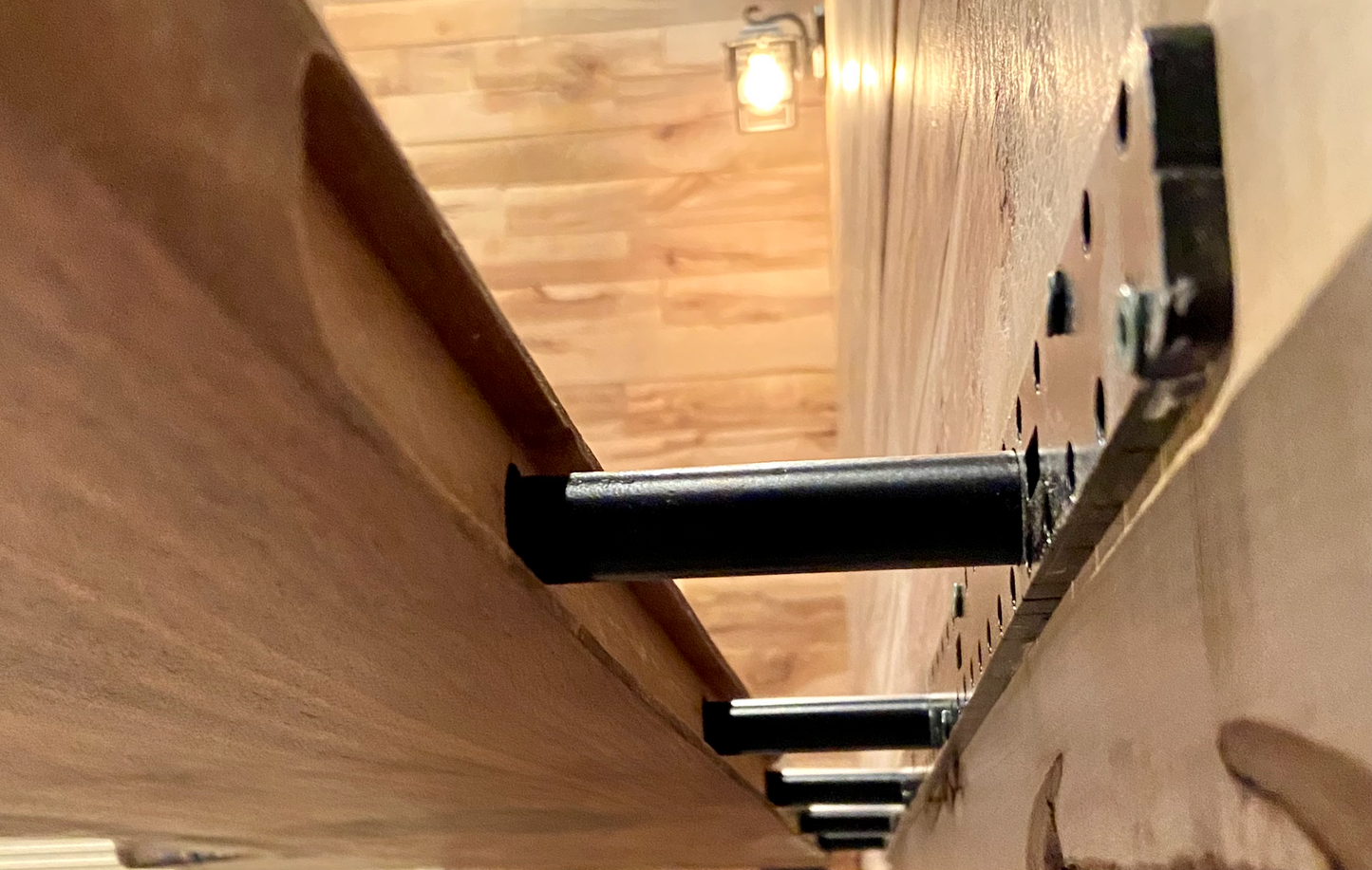 Live edge floating hidden shelf bracket option being installed with a shelf.