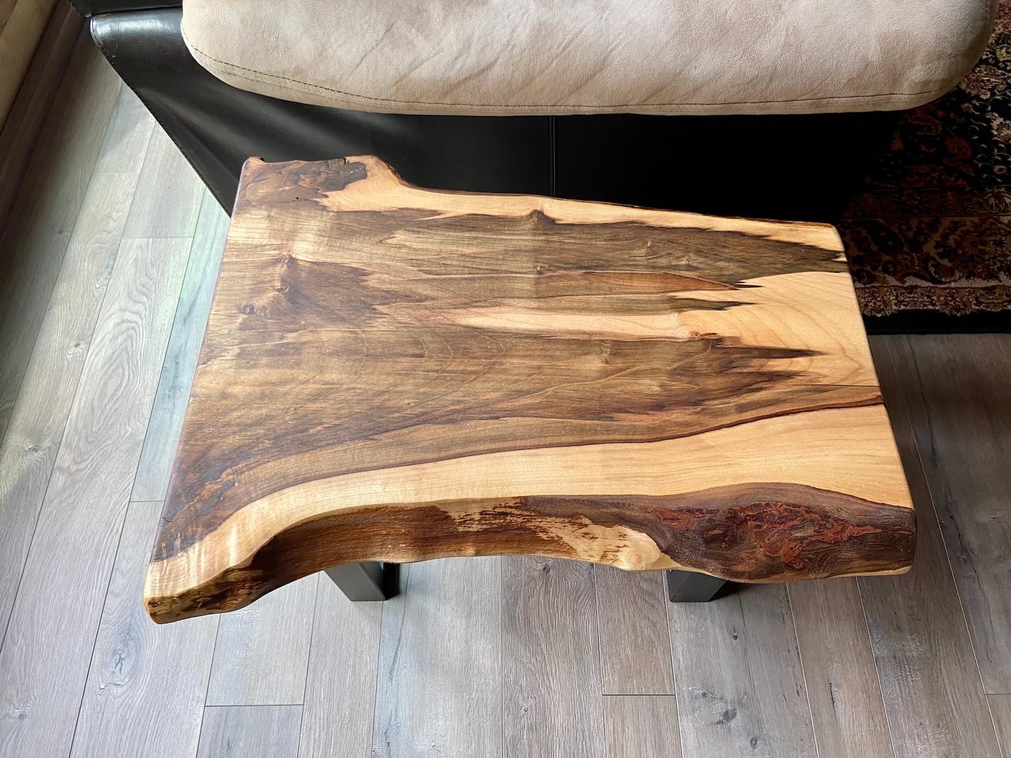 Detailed view of ambrosia maple wood grain, showing natural spalting, color variations, and organic patterns. live edge coffee table made from ambrosia maple, featuring unique grain patterns and a smooth, polished surface. Rustic and modern design. Handcrafted ambrosia maple coffee table styled in a modern living room with a cozy, rustic aesthetic. Top-down view of ambrosia maple coffee table, highlighting natural wood grain, warm tones, and live edge details.