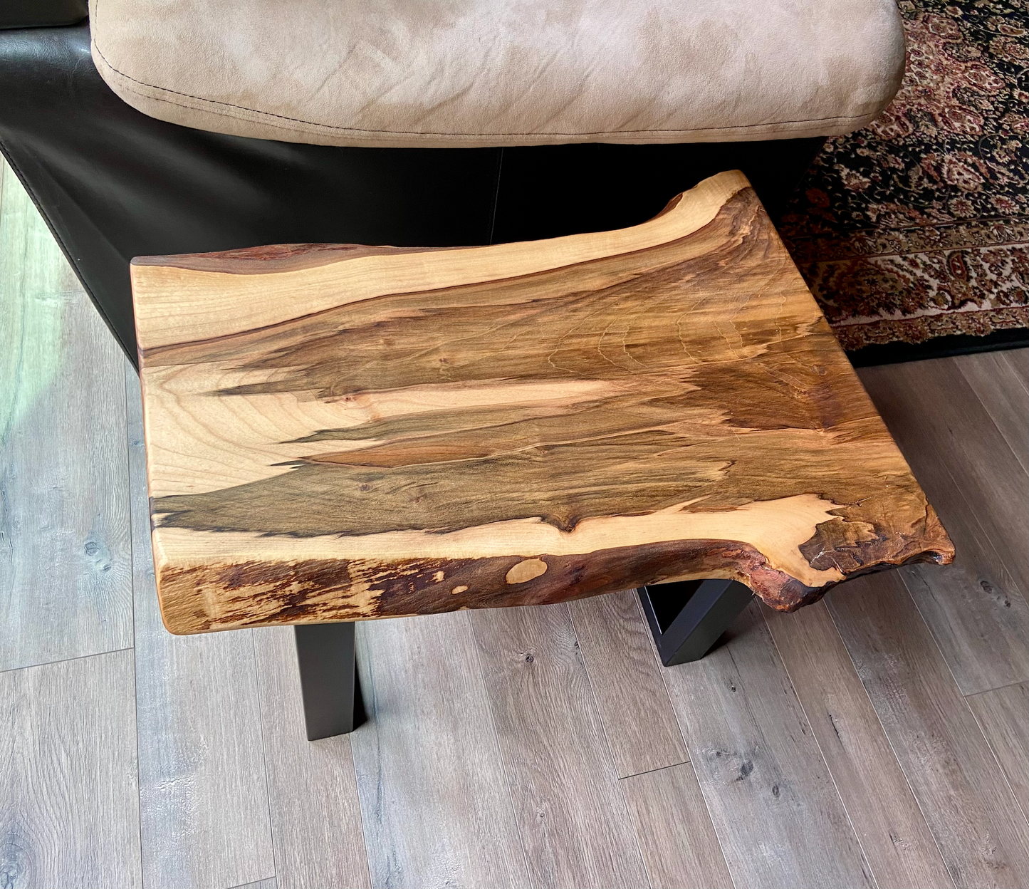 Detailed view of ambrosia maple wood grain, showing natural spalting, color variations, and organic patterns. live edge coffee table made from ambrosia maple, featuring unique grain patterns and a smooth, polished surface. Rustic and modern design. Handcrafted ambrosia maple coffee table styled in a modern living room with a cozy, rustic aesthetic. Top-down view of ambrosia maple coffee table, highlighting natural wood grain, warm tones, and live edge details.