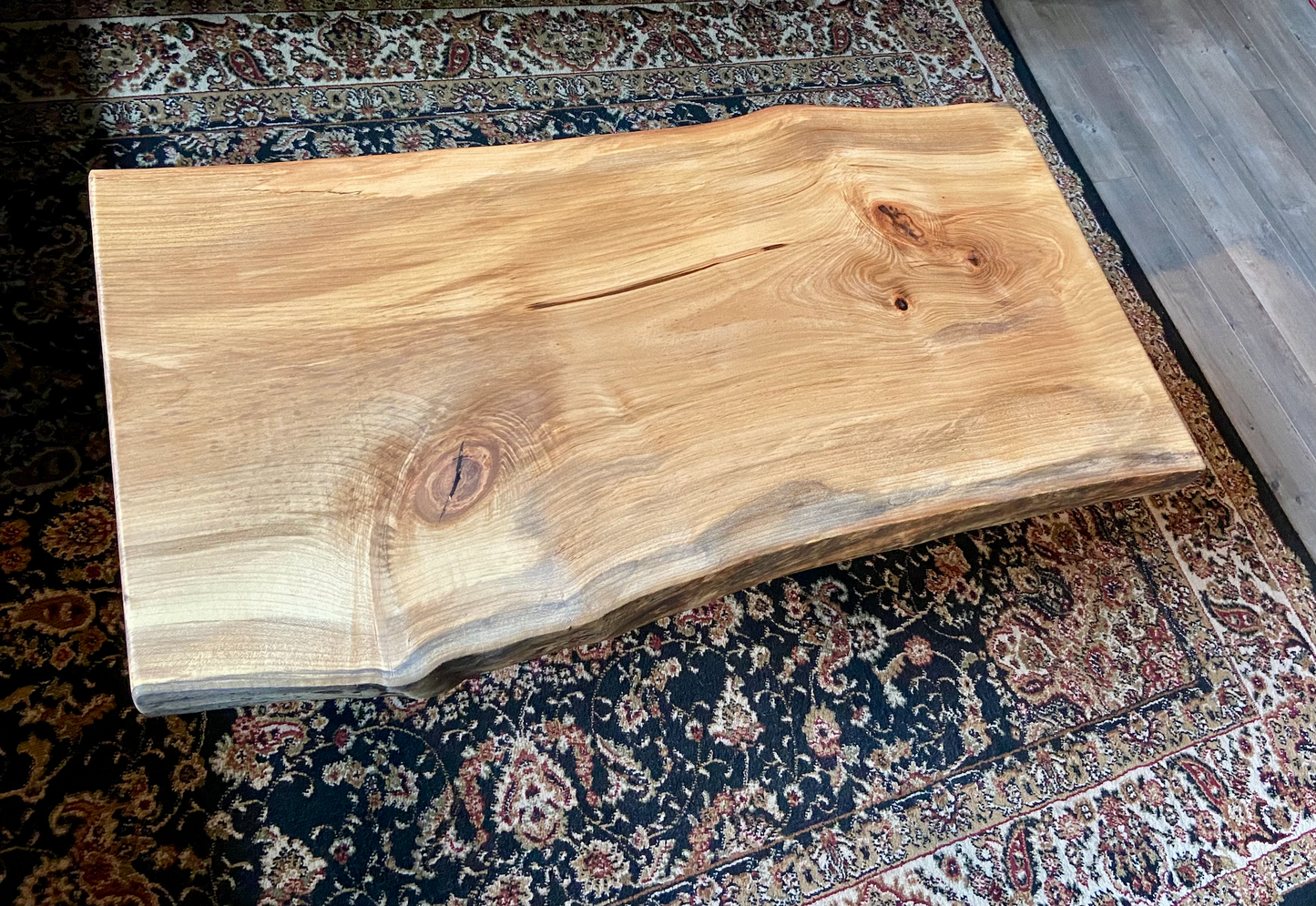 Detailed view of ambrosia maple wood grain, showing natural spalting, color variations, and organic patterns. live edge coffee table made from ambrosia maple, featuring unique grain patterns and a smooth, polished surface. Rustic and modern design. Handcrafted ambrosia maple coffee table styled in a modern living room with a cozy, rustic aesthetic. Top-down view of ambrosia maple coffee table, highlighting natural wood grain, warm tones, and live edge details.