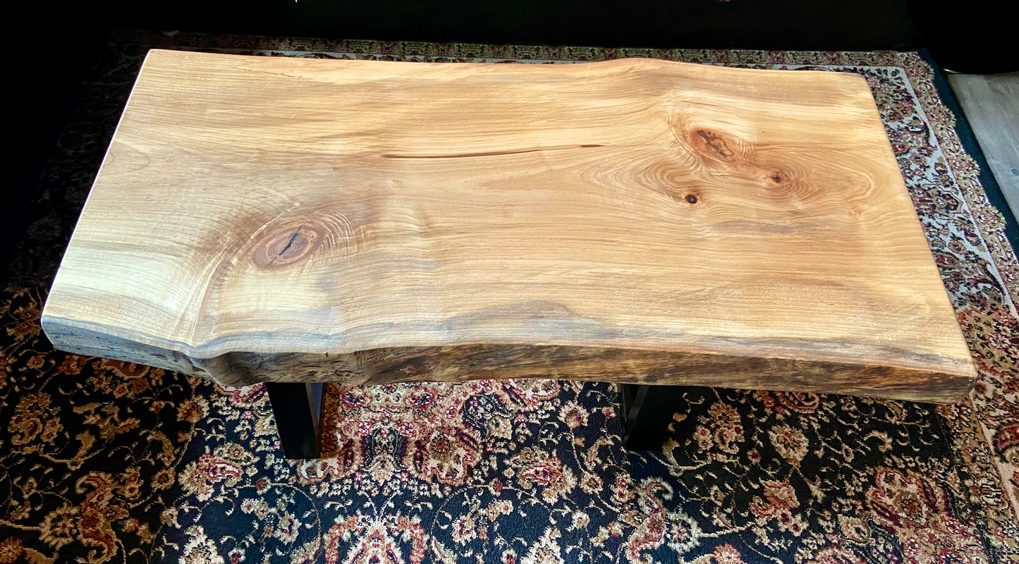 Detailed view of ambrosia maple wood grain, showing natural spalting, color variations, and organic patterns. live edge coffee table made from ambrosia maple, featuring unique grain patterns and a smooth, polished surface. Rustic and modern design. Handcrafted ambrosia maple coffee table styled in a modern living room with a cozy, rustic aesthetic. Top-down view of ambrosia maple coffee table, highlighting natural wood grain, warm tones, and live edge details.