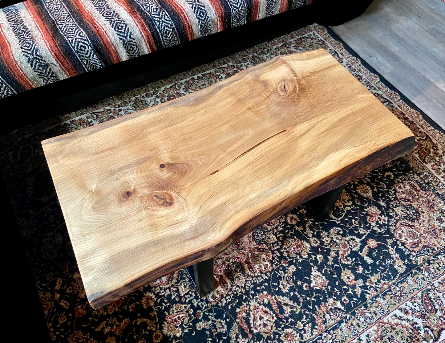 Detailed view of ambrosia maple wood grain, showing natural spalting, color variations, and organic patterns. live edge coffee table made from ambrosia maple, featuring unique grain patterns and a smooth, polished surface. Rustic and modern design. Handcrafted ambrosia maple coffee table styled in a modern living room with a cozy, rustic aesthetic. Top-down view of ambrosia maple coffee table, highlighting natural wood grain, warm tones, and live edge details.