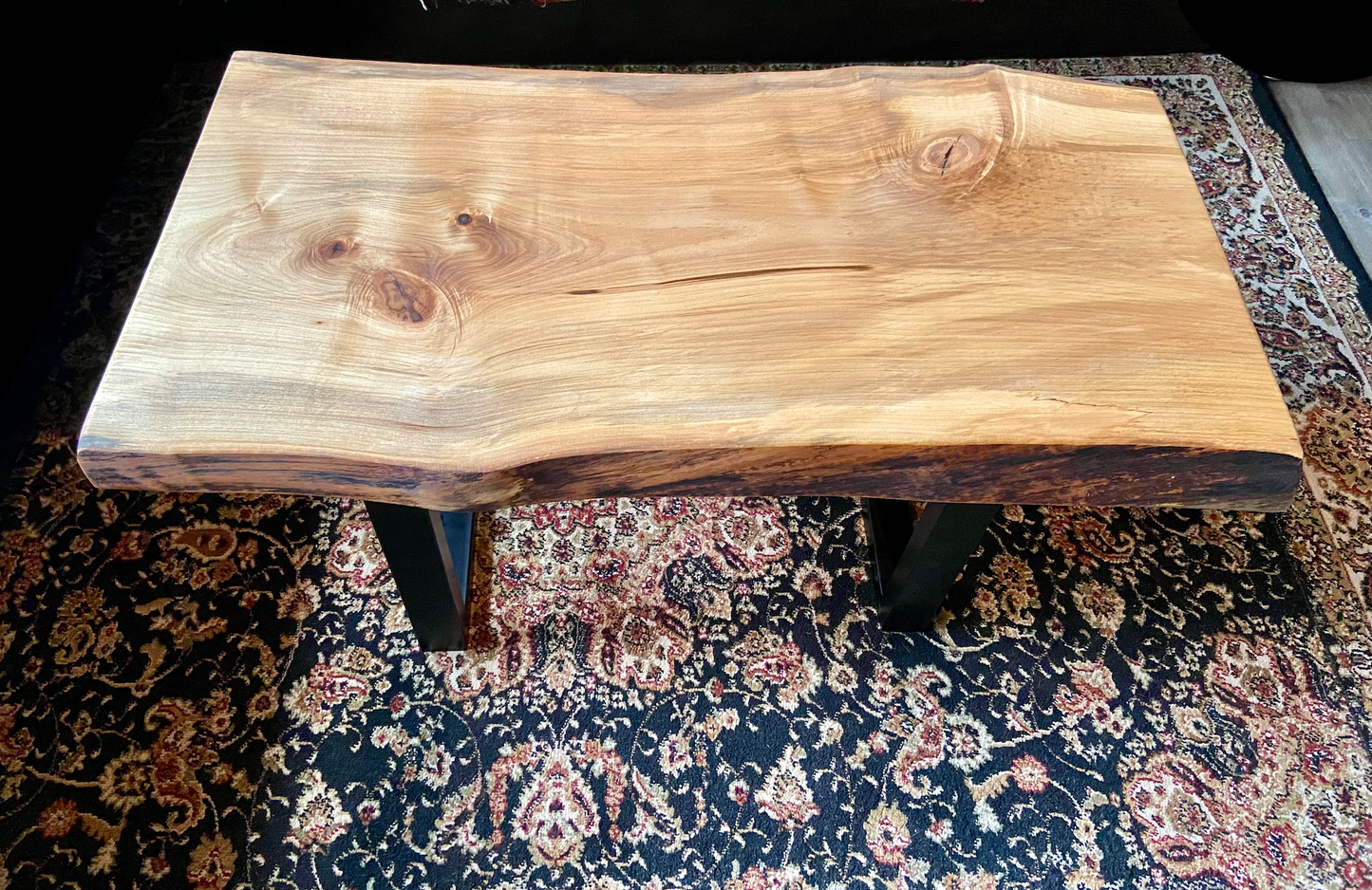 Detailed view of ambrosia maple wood grain, showing natural spalting, color variations, and organic patterns. live edge coffee table made from ambrosia maple, featuring unique grain patterns and a smooth, polished surface. Rustic and modern design. Handcrafted ambrosia maple coffee table styled in a modern living room with a cozy, rustic aesthetic. Top-down view of ambrosia maple coffee table, highlighting natural wood grain, warm tones, and live edge details.