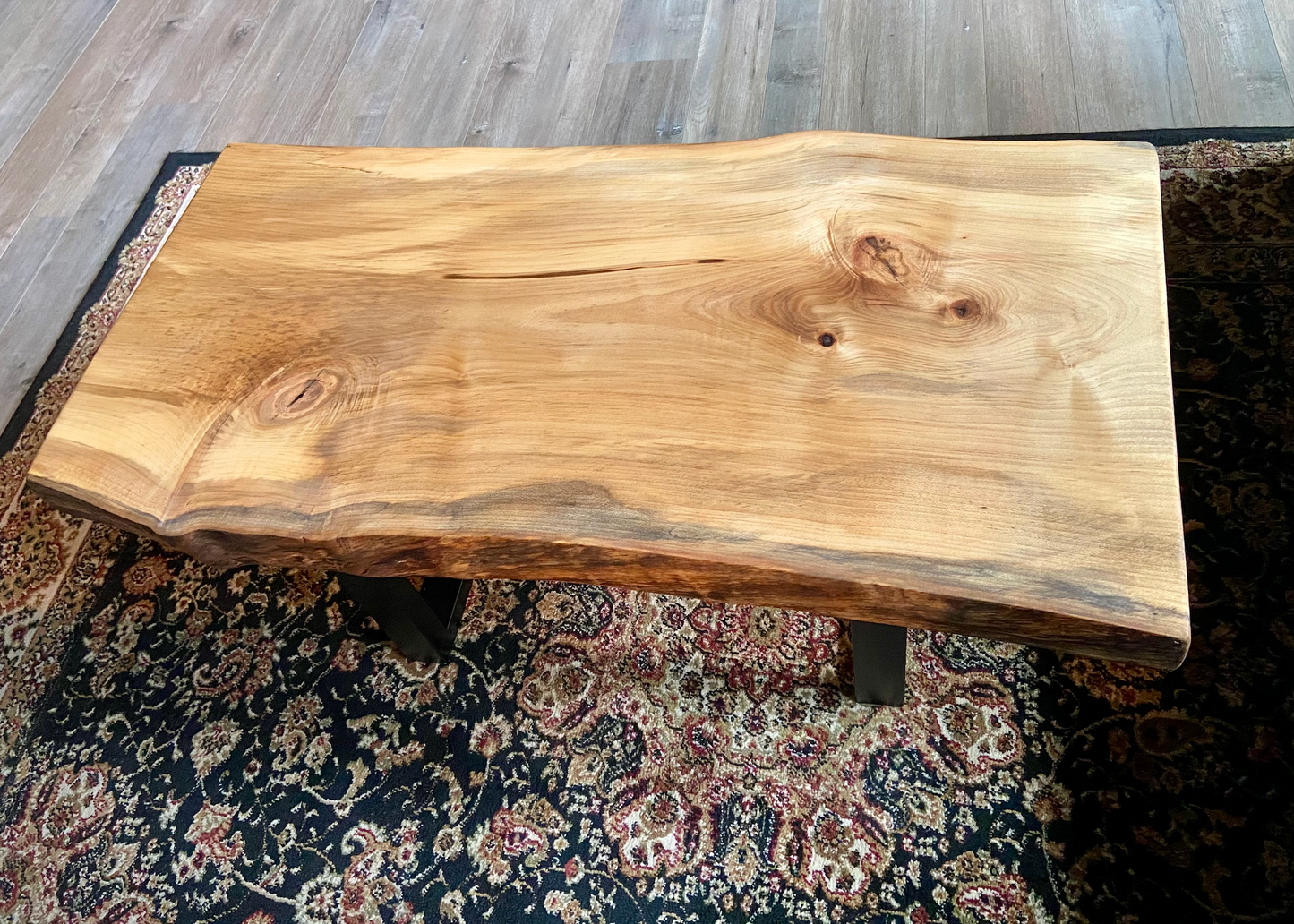 Detailed view of ambrosia maple wood grain, showing natural spalting, color variations, and organic patterns. live edge coffee table made from ambrosia maple, featuring unique grain patterns and a smooth, polished surface. Rustic and modern design. Handcrafted ambrosia maple coffee table styled in a modern living room with a cozy, rustic aesthetic. Top-down view of ambrosia maple coffee table, highlighting natural wood grain, warm tones, and live edge details.