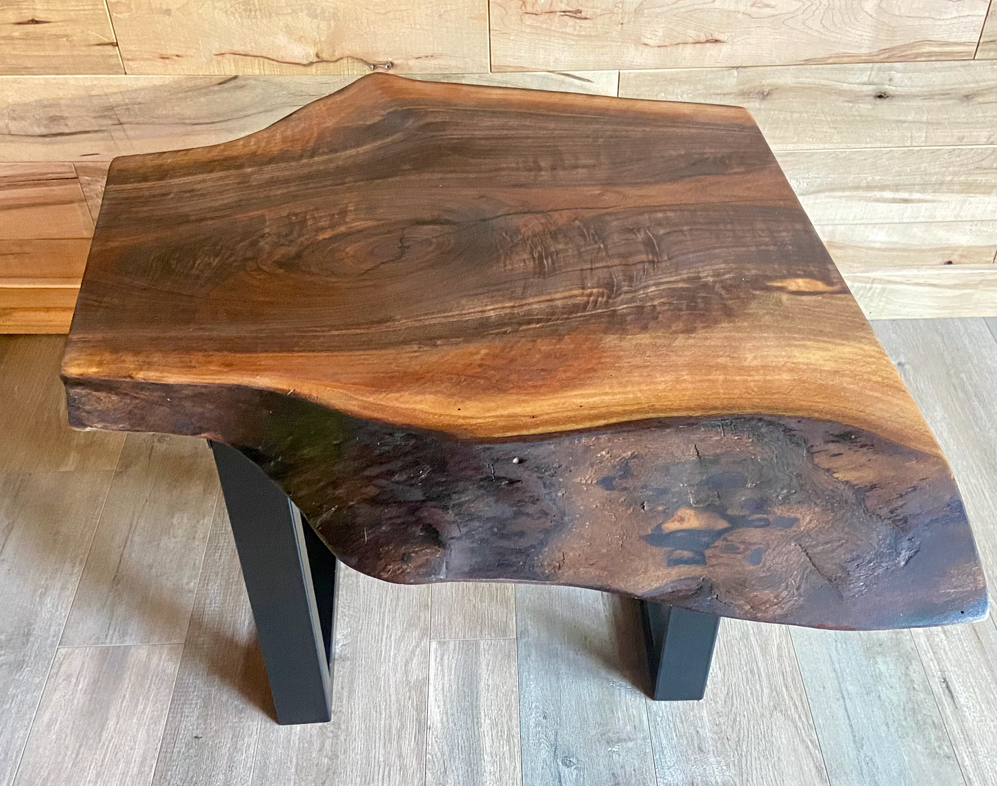 Wooden table with a natural finish on a wooden floor