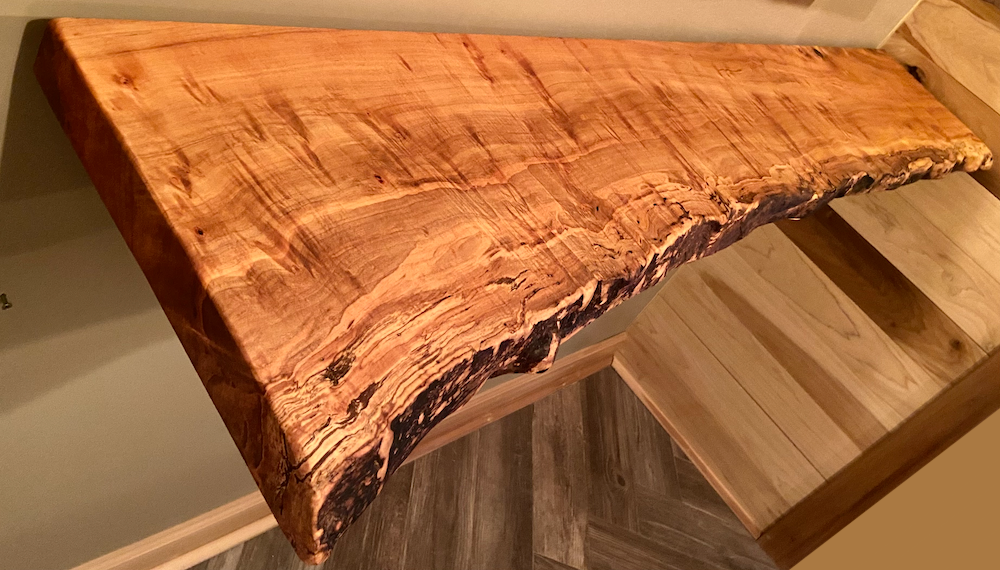Custom live edge maple shelves with natural wood grain, handcrafted from solid maple. Ideal for rustic, modern, or farmhouse interiors.