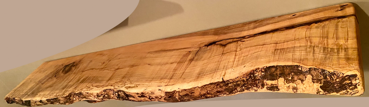 Custom live edge maple shelves with natural wood grain, handcrafted from solid maple. Ideal for rustic, modern, or farmhouse interiors.