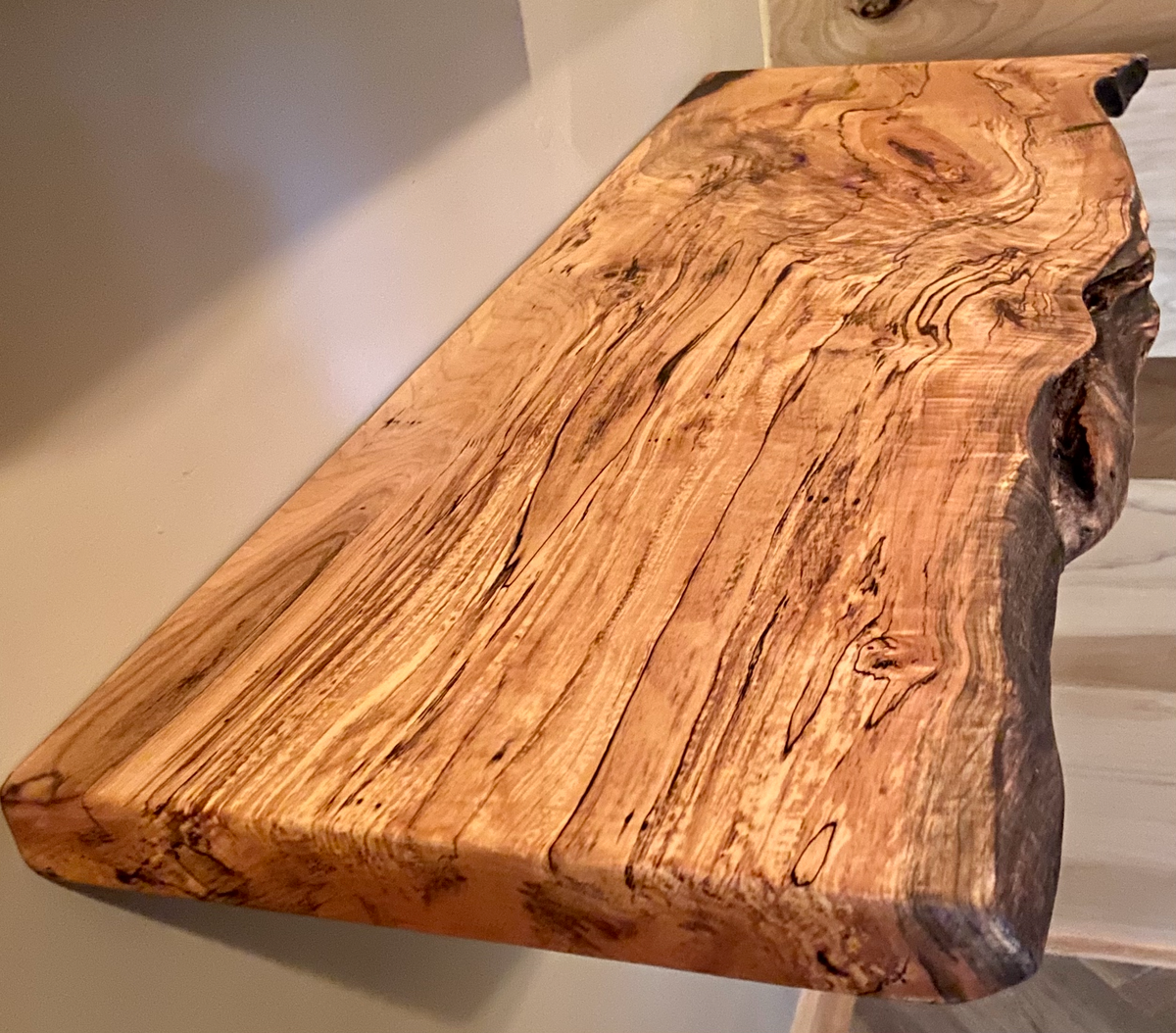 Custom live edge maple shelves with natural wood grain, handcrafted from solid maple. Ideal for rustic, modern, or farmhouse interiors.