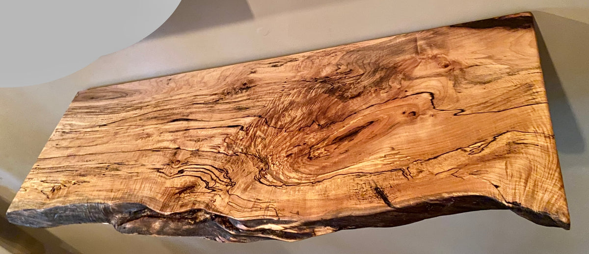 Custom live edge maple shelves with natural wood grain, handcrafted from solid maple. Ideal for rustic, modern, or farmhouse interiors.