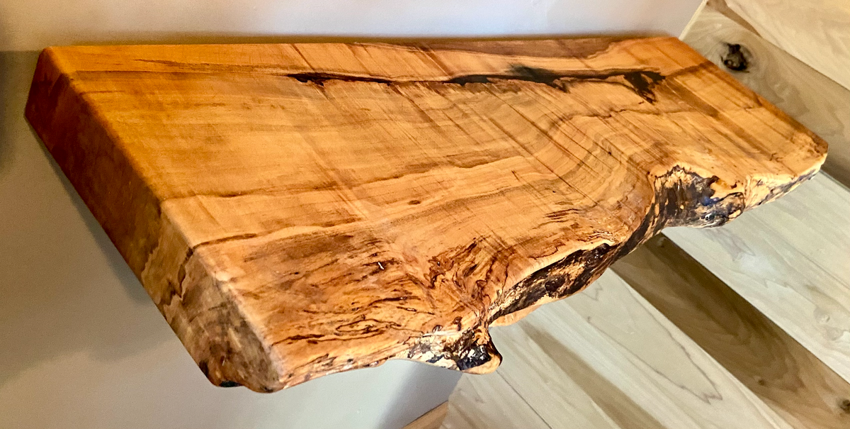 Custom live edge maple shelves with natural wood grain, handcrafted from solid maple. Ideal for rustic, modern, or farmhouse interiors.