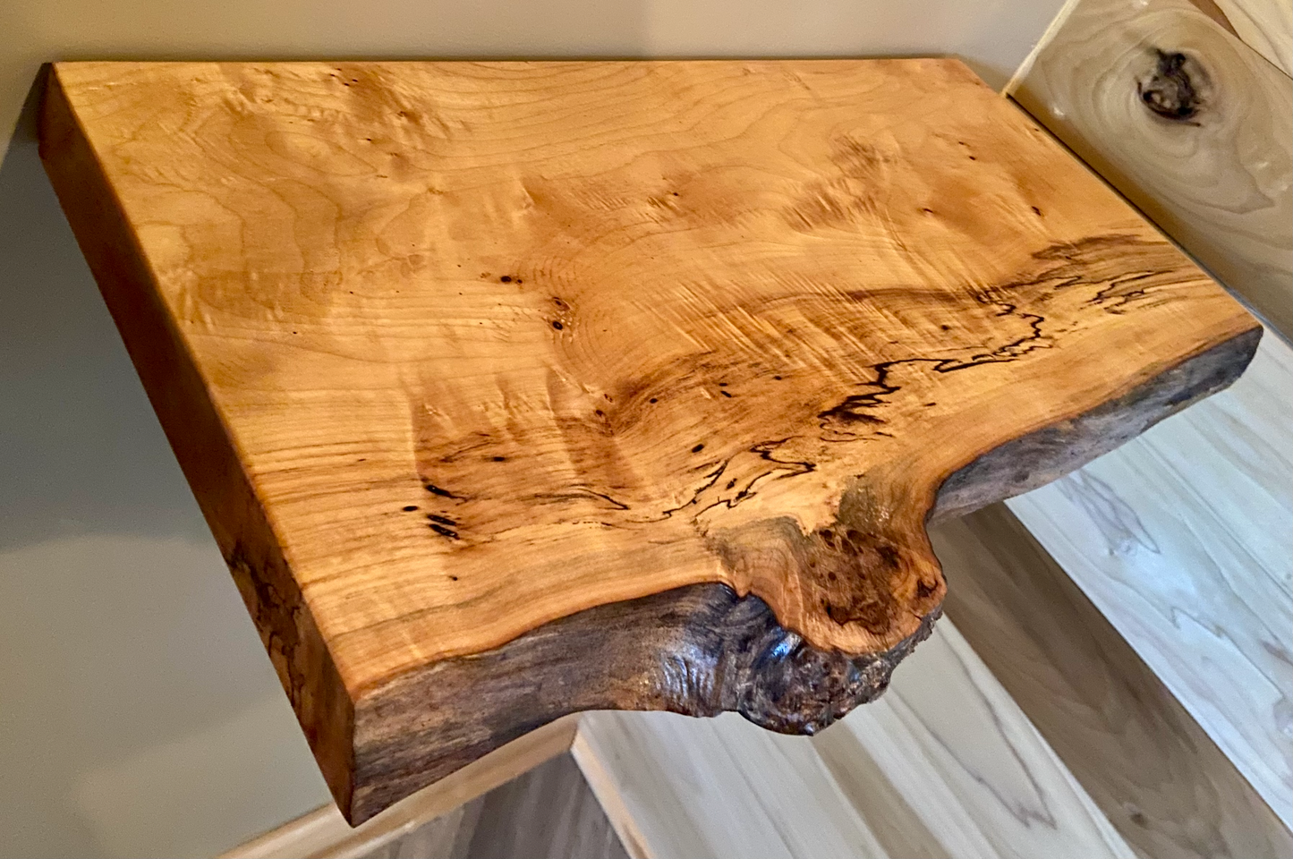 Custom live edge maple shelves with natural wood grain, handcrafted from solid maple. Ideal for rustic, modern, or farmhouse interiors.