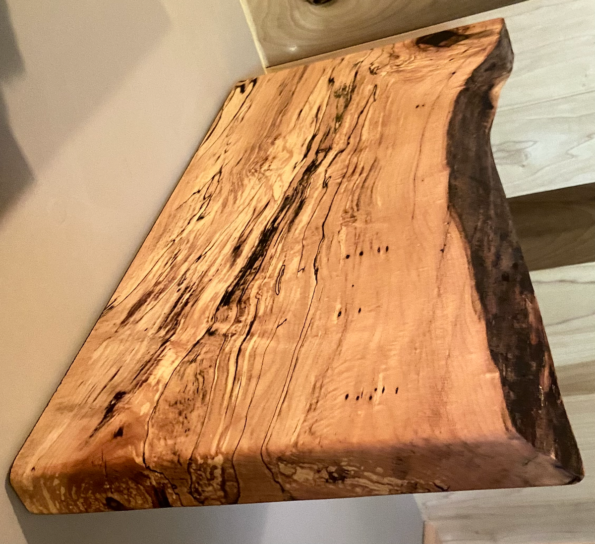 Custom live edge maple shelves with natural wood grain, handcrafted from solid maple. Ideal for rustic, modern, or farmhouse interiors.