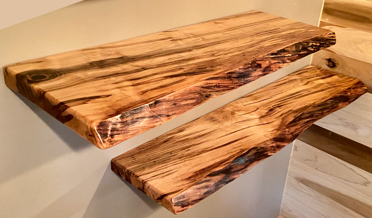 Custom live edge maple shelves with natural wood grain, handcrafted from solid maple. Ideal for rustic, modern, or farmhouse interiors.