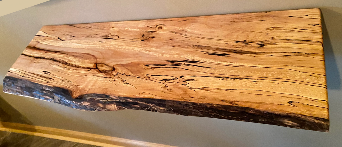 Custom live edge maple shelves with natural wood grain, handcrafted from solid maple. Ideal for rustic, modern, or farmhouse interiors.
