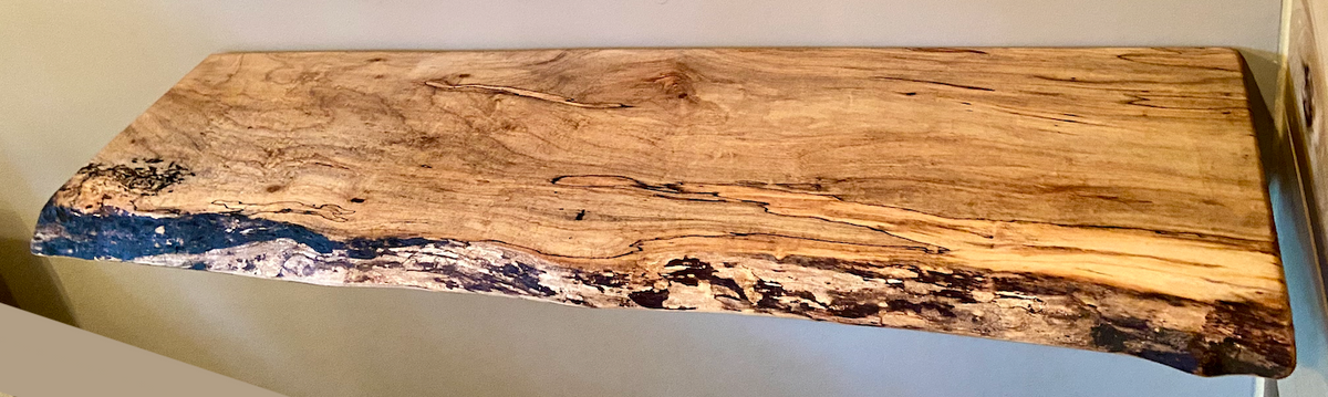 Custom live edge maple shelves with natural wood grain, handcrafted from solid maple. Ideal for rustic, modern, or farmhouse interiors.