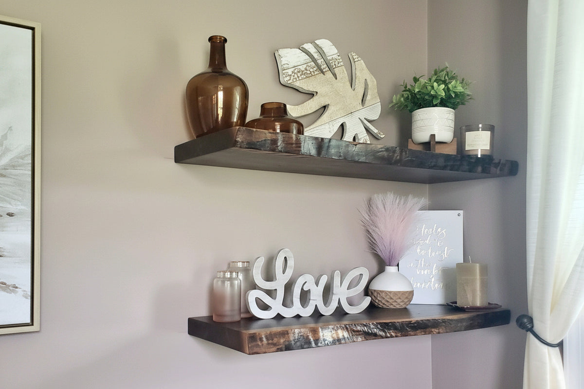 Custom live edge walnut shelves featuring rich, dark brown wood grain and organic edges. Handcrafted for stylish, rustic home decor.