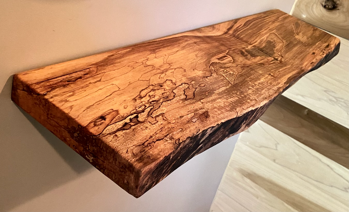 Custom live edge maple shelves with natural wood grain, handcrafted from solid maple. Ideal for rustic, modern, or farmhouse interiors.