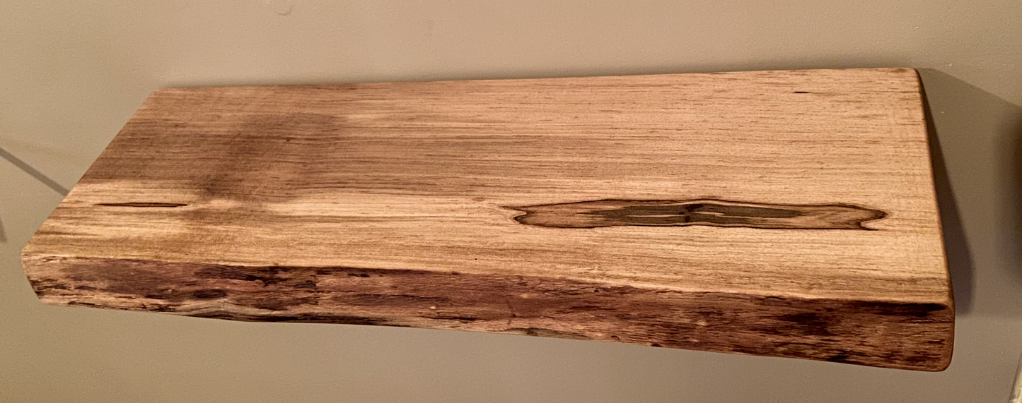 Custom live edge maple shelves with natural wood grain, handcrafted from solid maple. Ideal for rustic, modern, or farmhouse interiors.