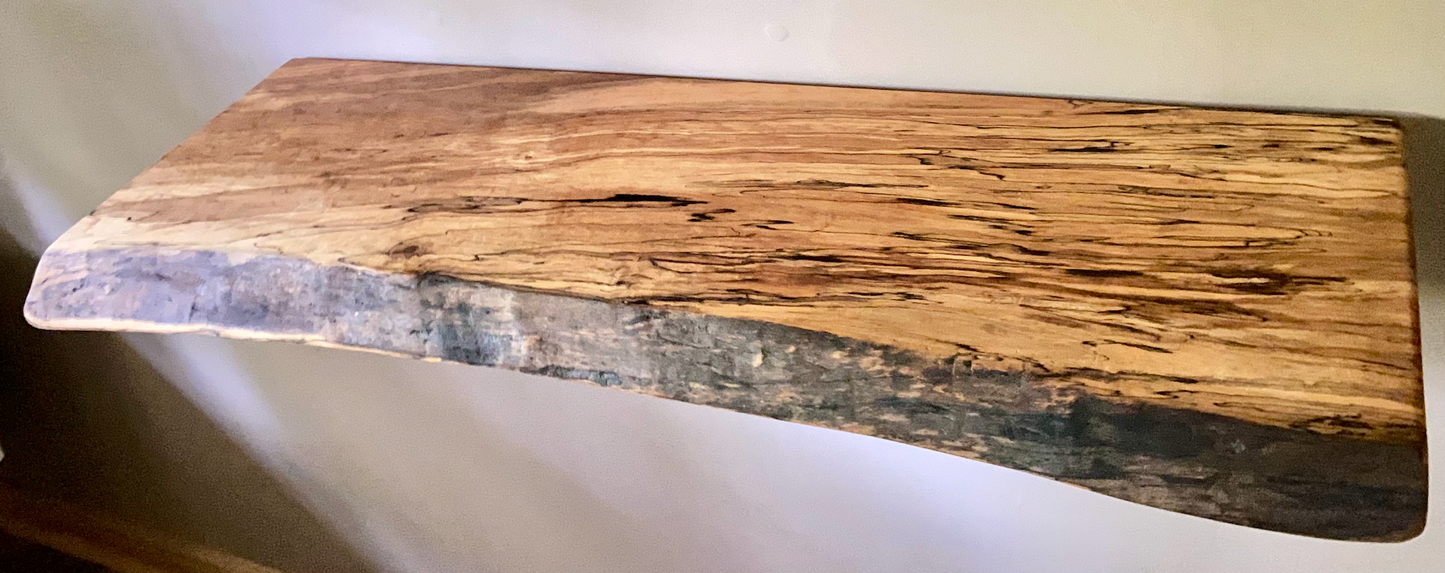 Custom live edge maple shelves with natural wood grain, handcrafted from solid maple. Ideal for rustic, modern, or farmhouse interiors.