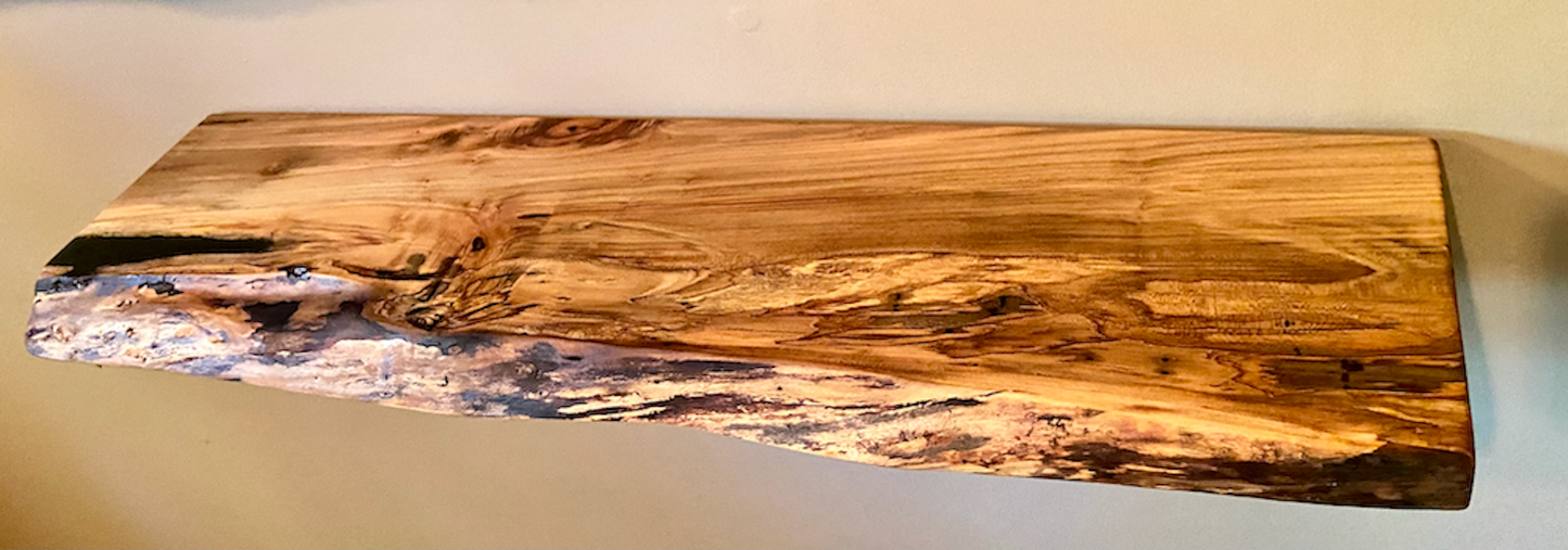 Custom live edge maple shelves with natural wood grain, handcrafted from solid maple. Ideal for rustic, modern, or farmhouse interiors.