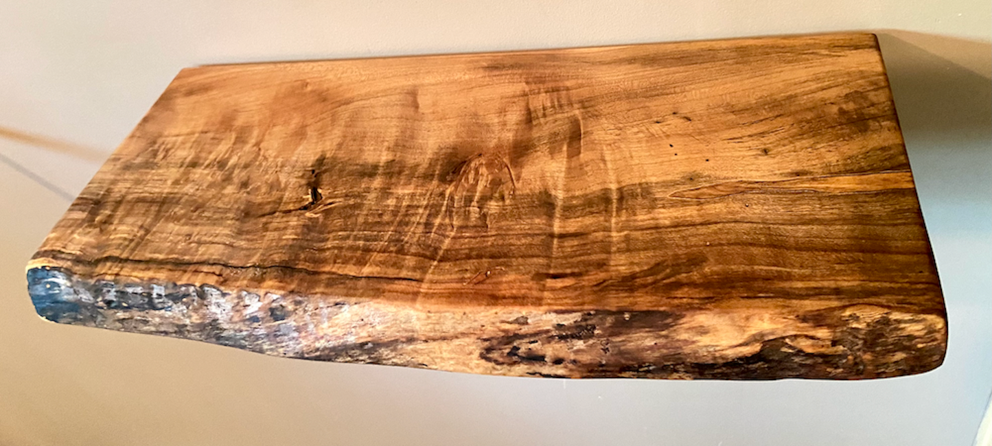Custom live edge maple shelves with natural wood grain, handcrafted from solid maple. Ideal for rustic, modern, or farmhouse interiors.