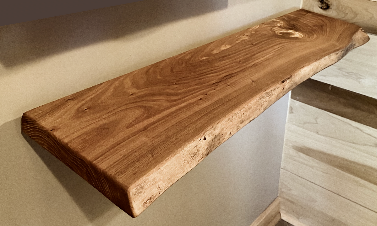Custom live edge chestnut shelves with warm golden-brown tones and a natural edge. Solid chestnut wood, perfect for rustic and modern interiors.