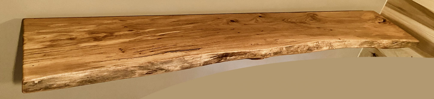 Custom live edge chestnut shelves with warm golden-brown tones and a natural edge. Solid chestnut wood, perfect for rustic and modern interiors.