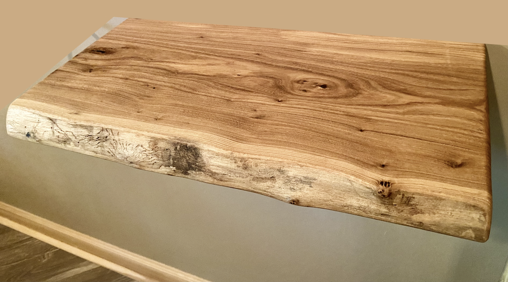 Custom live edge chestnut shelves with warm golden-brown tones and a natural edge. Solid chestnut wood, perfect for rustic and modern interiors.