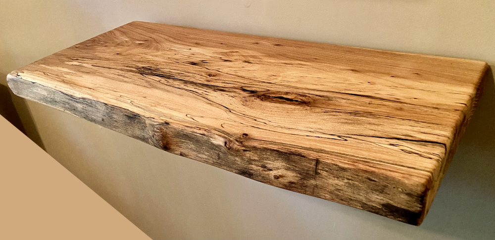 Custom live edge chestnut shelves with warm golden-brown tones and a natural edge. Solid chestnut wood, perfect for rustic and modern interiors.