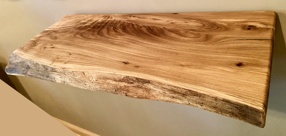 Custom live edge chestnut shelves with warm golden-brown tones and a natural edge. Solid chestnut wood, perfect for rustic and modern interiors.