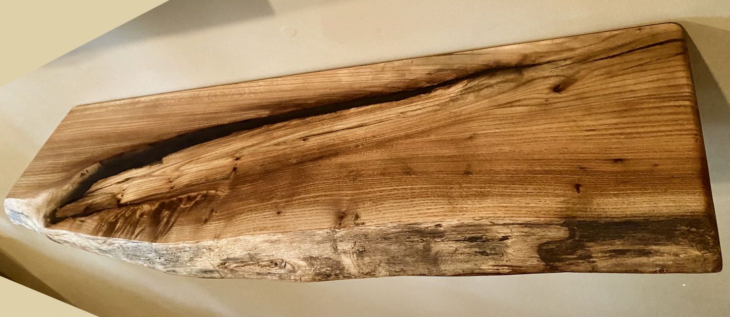 Custom live edge chestnut shelves with warm golden-brown tones and a natural edge. Solid chestnut wood, perfect for rustic and modern interiors.