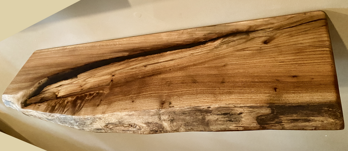 Custom live edge chestnut shelves with warm golden-brown tones and a natural edge. Solid chestnut wood, perfect for rustic and modern interiors.