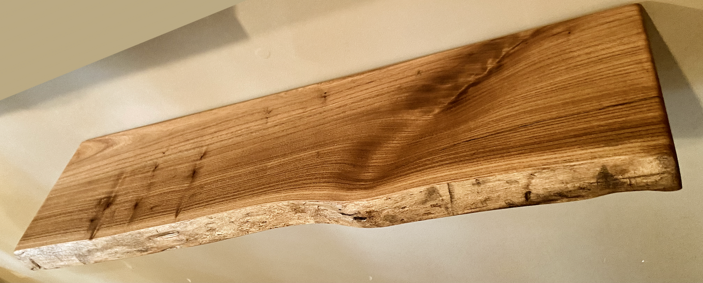 Custom live edge chestnut shelves with warm golden-brown tones and a natural edge. Solid chestnut wood, perfect for rustic and modern interiors.