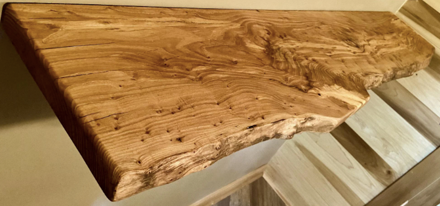 Custom live edge chestnut shelves with warm golden-brown tones and a natural edge. Solid chestnut wood, perfect for rustic and modern interiors.
