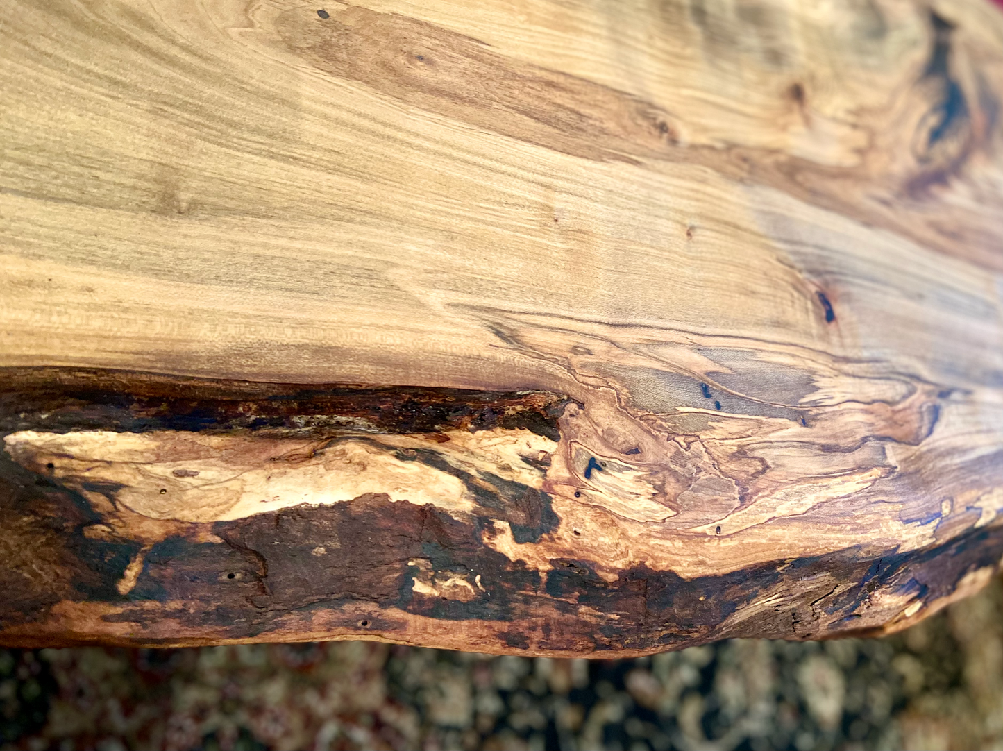 Top-down view of live edge ambrosia maple coffee table, highlighting natural wood grain, warm tones, and live edge details. Detailed view of ambrosia maple wood grain, showing natural spalting, color variations, and organic patterns. Curved live edge coffee table made from ambrosia maple, featuring unique grain patterns and a smooth, polished surface. Rustic and modern design.