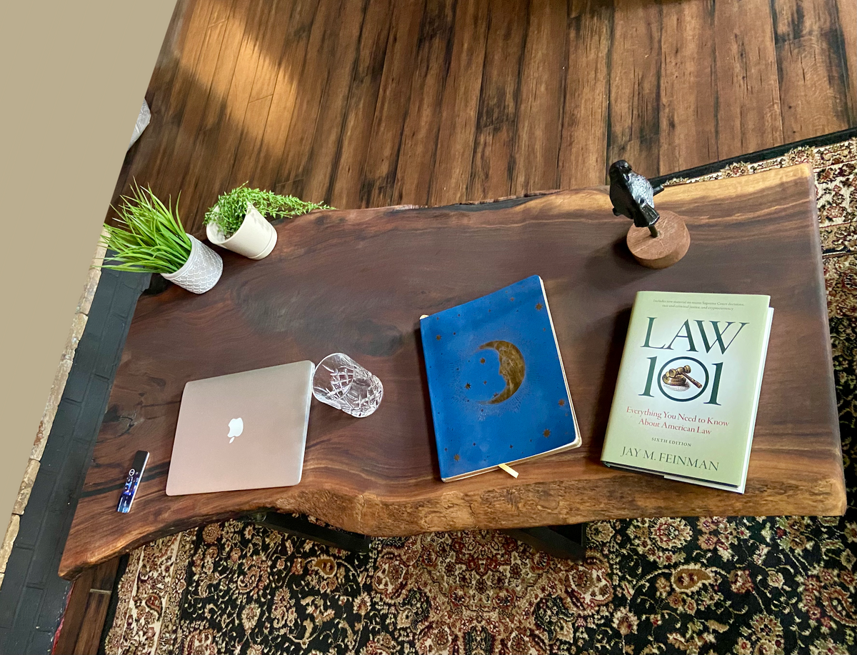 Top-down view of large live edge black walnut coffee table with household items, highlighting natural wood grain, and live edge details. Handcrafted live edge walnut coffee table styled in a modern living room with a cozy, rustic aesthetic. Detailed view of live edge walnut wood grain, showing natural color variations, and organic patterns. Large live edge black walnut coffee table made from walnut featuring unique grain patterns and a smooth, polished surface. Rustic and modern design.