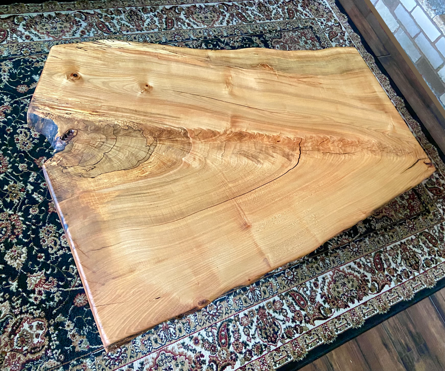 Top-down view of live edge ambrosia maple coffee table, highlighting natural wood grain, and live edge details. Handcrafted spalted maple coffee table styled in a modern living room with a cozy, rustic aesthetic. Detailed view of fiddleback maple wood grain, showing natural spalting, color variations, and organic patterns. Forked live edge coffee table made from spalted maple, featuring unique grain patterns and a smooth, polished surface. Rustic and modern design.