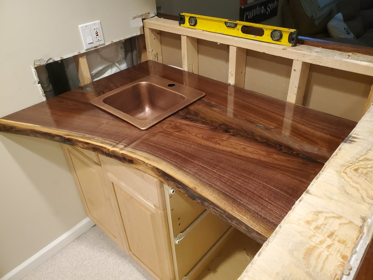 custom live edge black walnut bar top with epoxy