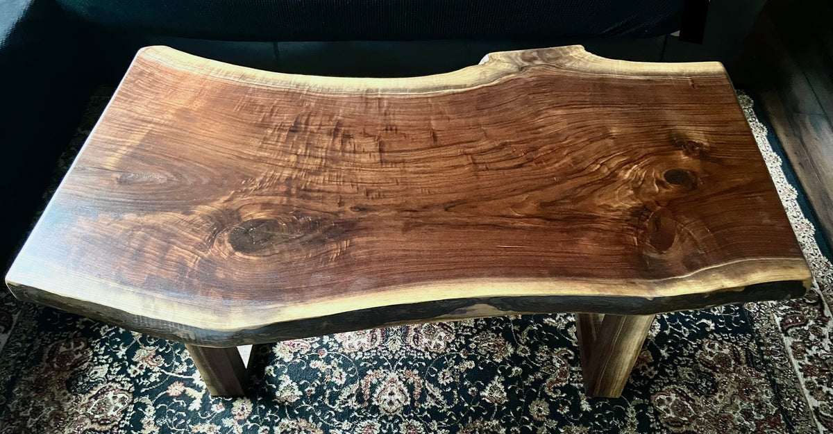 Beautiful live edge walnut coffee table with handcrafted square walnut legs from the same tree to complement.