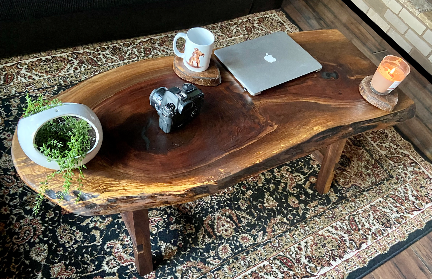 Ultra unique oval rustic natural live edge black walnut coffee table offers natural walnut wood with gorgeous grain patterns, complete with a large knot, a smaller knot, radial grain dancing around the entire table, completed with curl and a long oval shape.