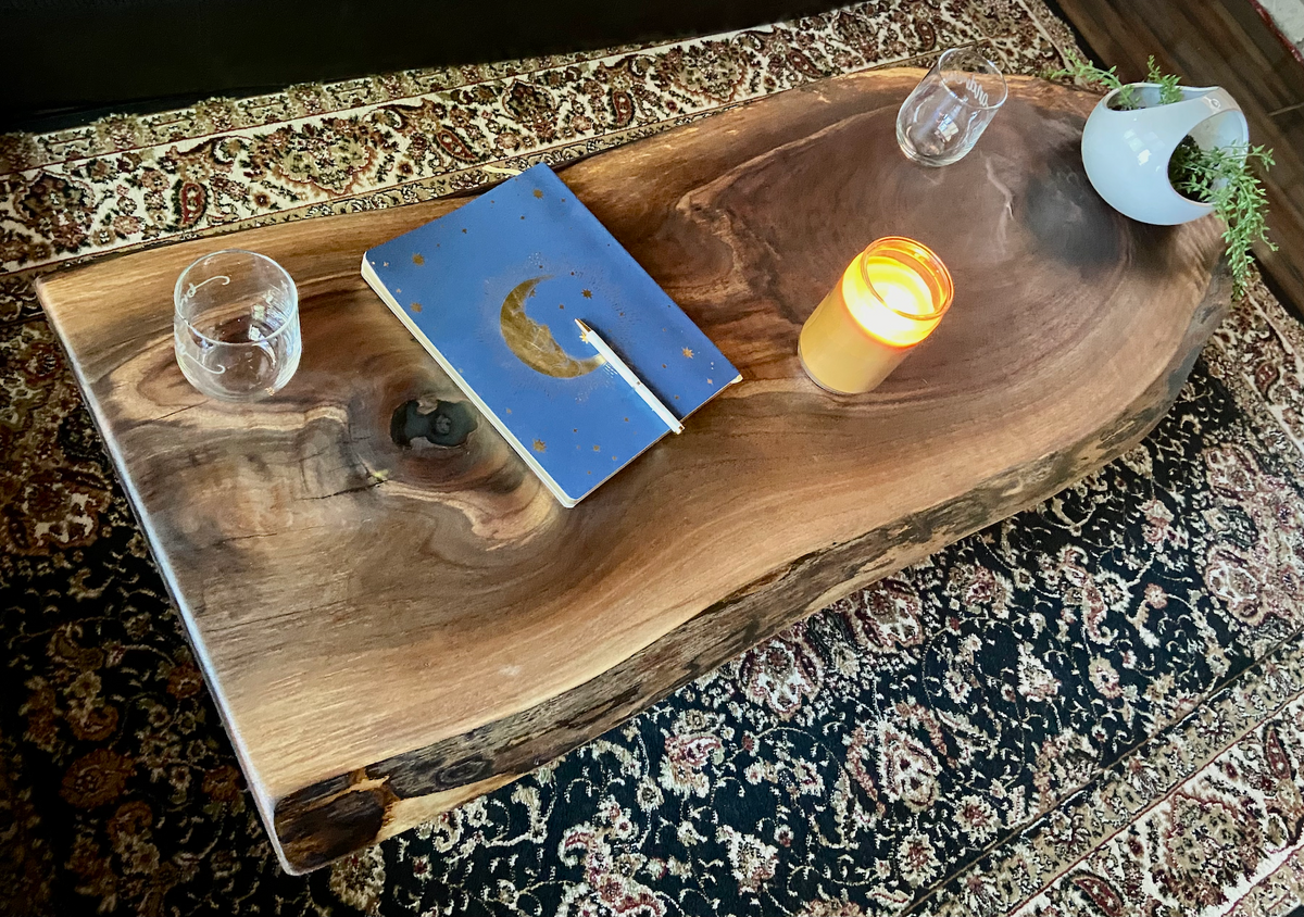 Live edge black walnut wood coffee table with gorgeous grain patterns, complete with a large knot, a smaller knot, and radial grain dancing around the entire table.Ultra unique oval rustic natural live edge black walnut coffee table offers natural walnut wood with gorgeous grain patterns, complete with a large knot, a smaller knot, radial grain dancing around the entire table, completed with curl and a long oval shape.