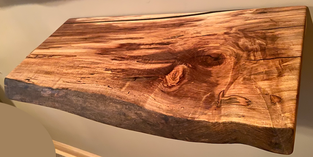 Handmade spalted hardwood vanity top with smooth finish and organic live edge front. Solid wood bathroom vanity top featuring spalted grain, knot detail, and natural character. 