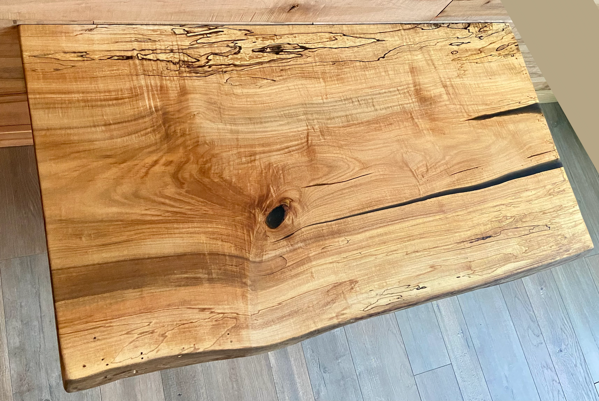 Handmade spalted hardwood vanity top with smooth finish and organic live edge front. Solid wood bathroom vanity top featuring spalted grain, knot detail, and natural character. 
