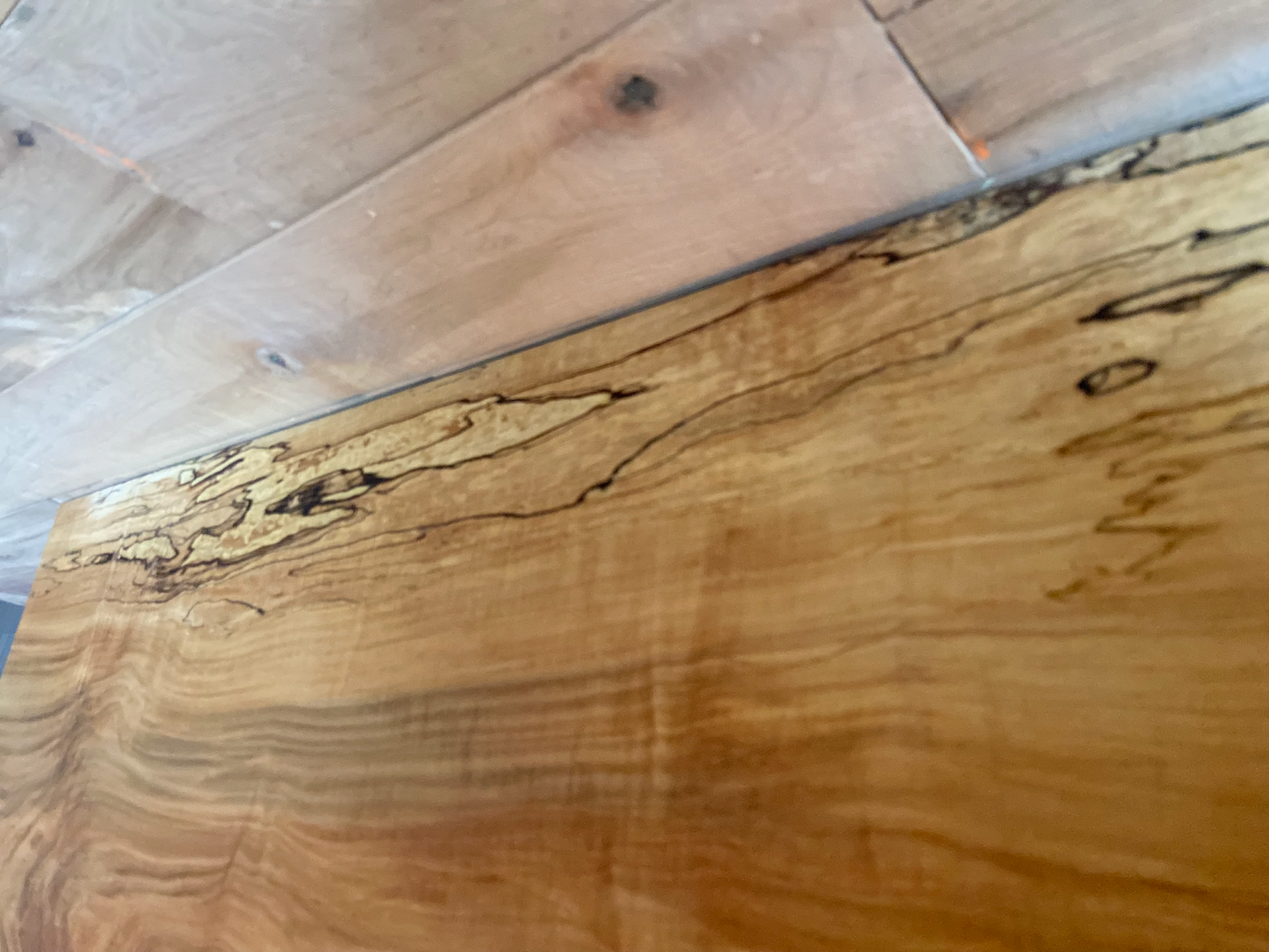 Handmade spalted hardwood vanity top with smooth finish and organic live edge front. Solid wood bathroom vanity top featuring spalted grain, knot detail, and natural character. 