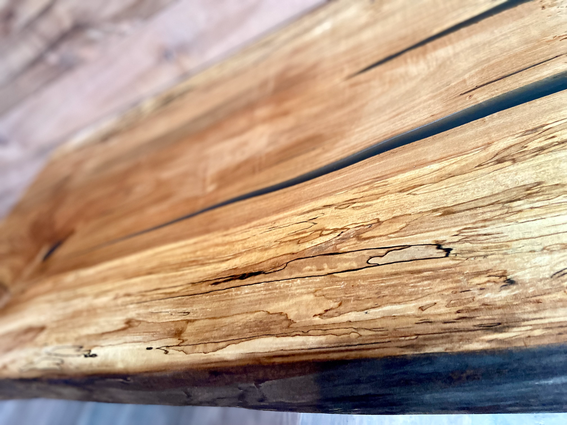 Handmade spalted hardwood vanity top with smooth finish and organic live edge front. Solid wood bathroom vanity top featuring spalted grain, knot detail, and natural character. 