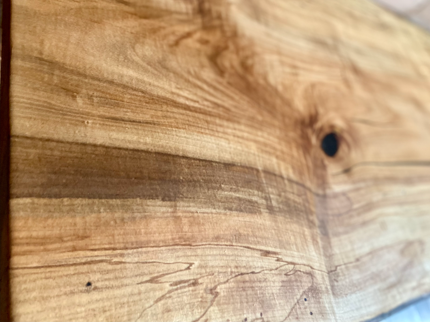 Handmade spalted hardwood vanity top with smooth finish and organic live edge front. Solid wood bathroom vanity top featuring spalted grain, knot detail, and natural character. 