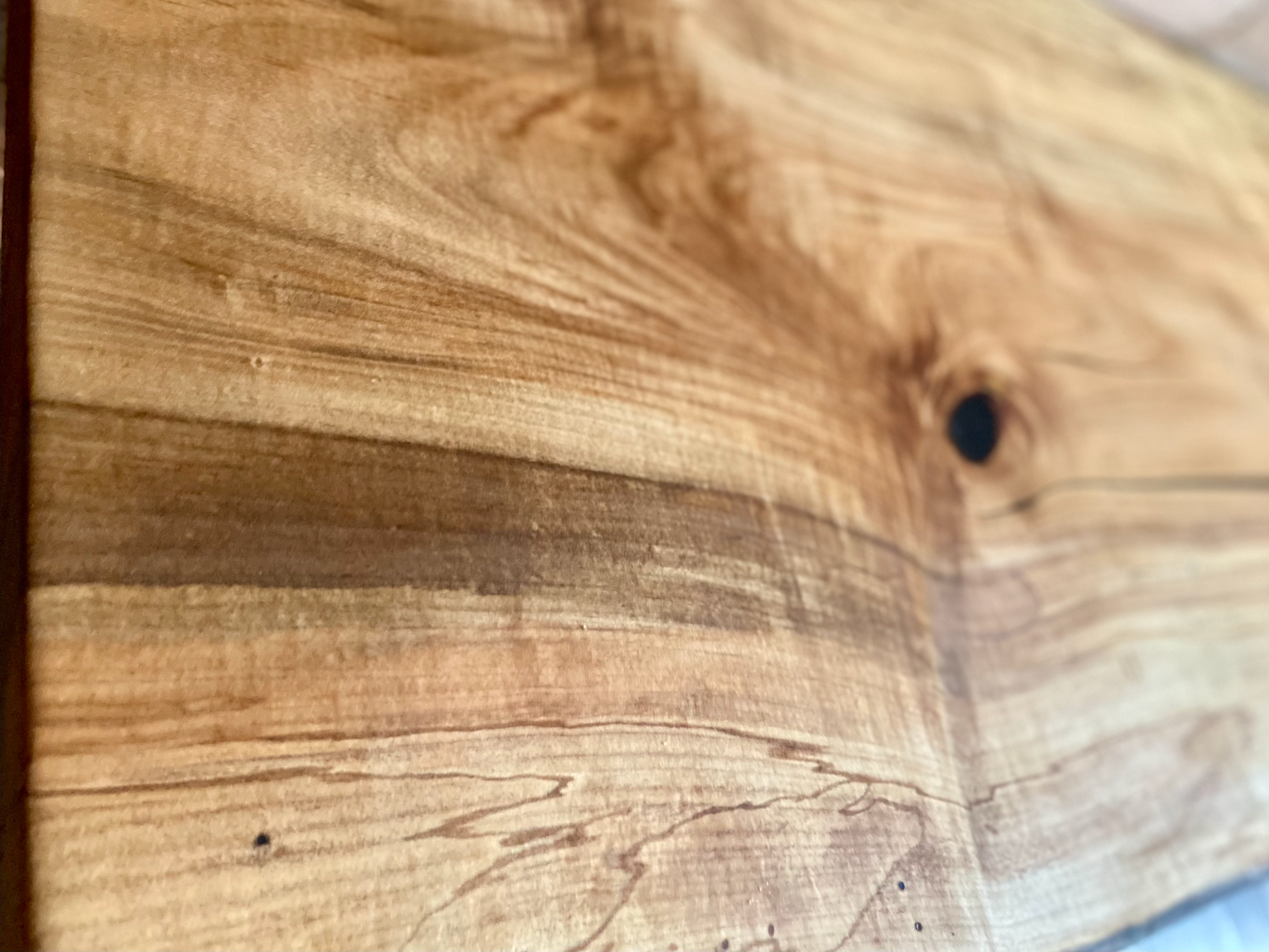 Handmade spalted hardwood vanity top with smooth finish and organic live edge front. Solid wood bathroom vanity top featuring spalted grain, knot detail, and natural character. 