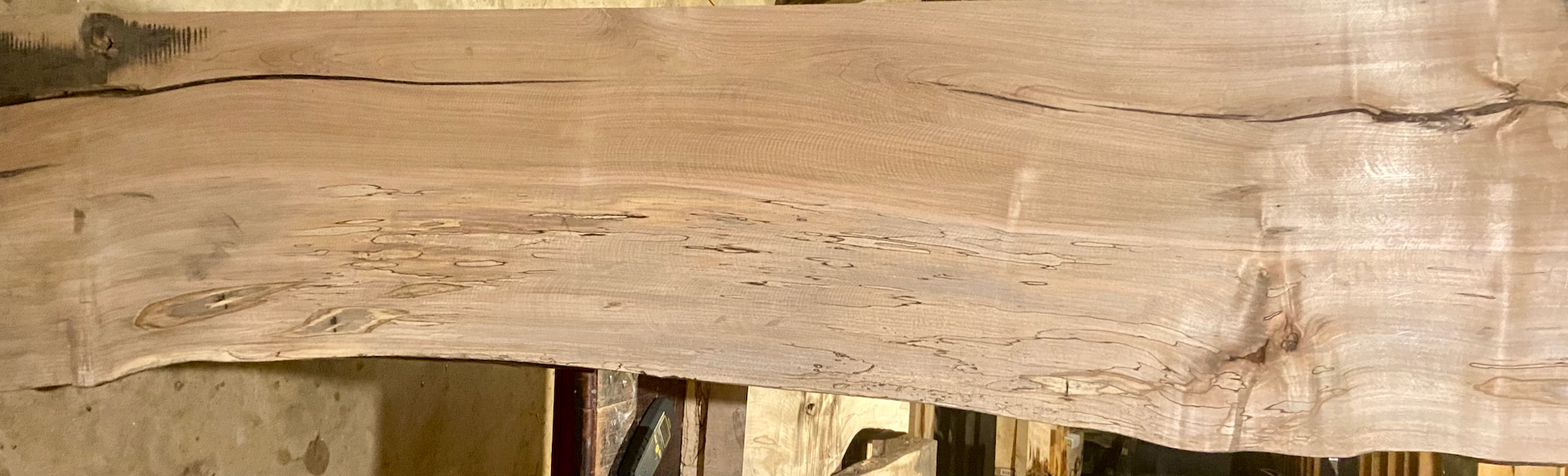 Handmade spalted hardwood vanity top with smooth finish and organic live edge front. Solid wood bathroom vanity top featuring spalted grain, knot detail, and natural character.