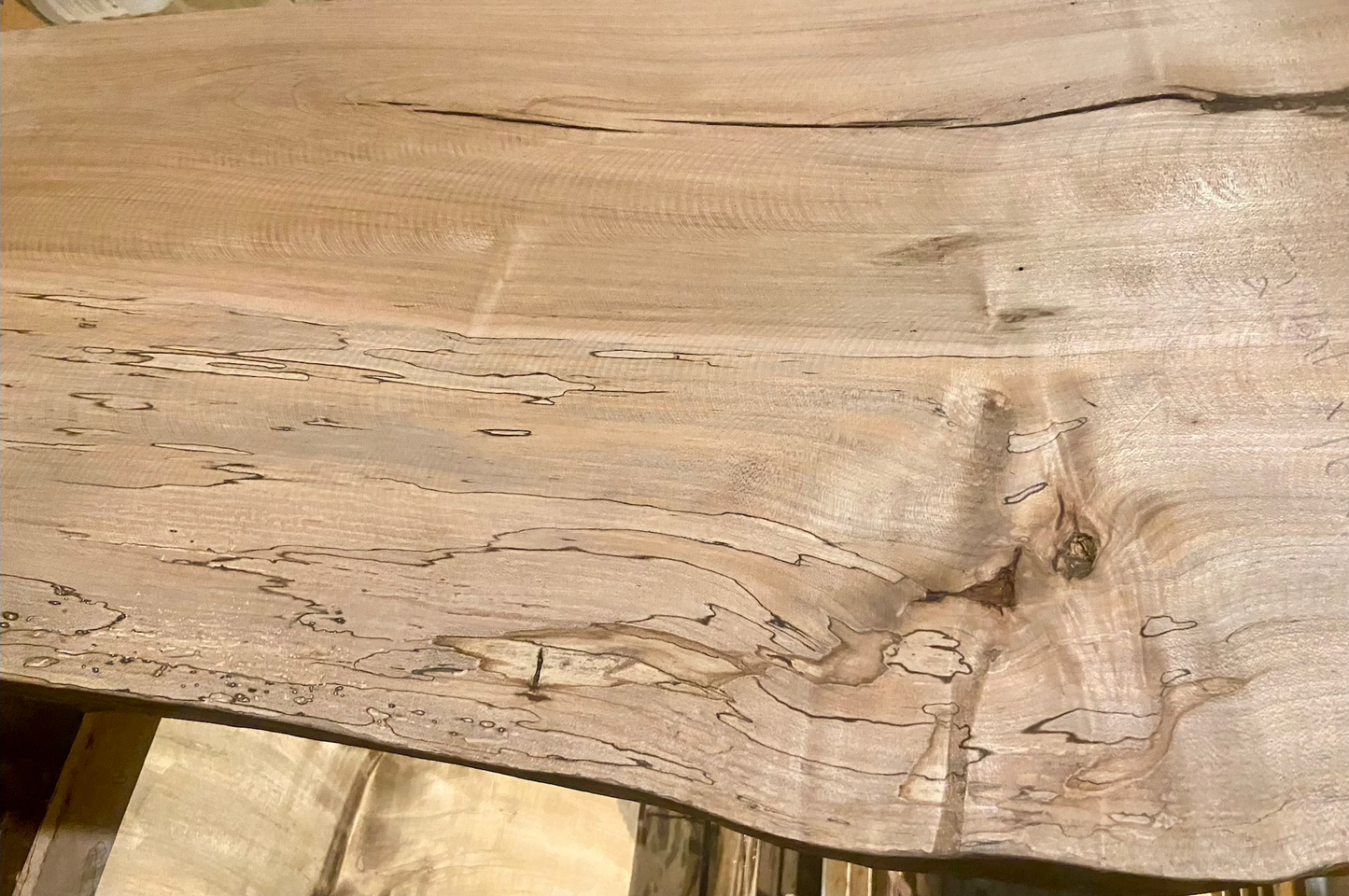 Handmade spalted hardwood vanity top with smooth finish and organic live edge front. Solid wood bathroom vanity top featuring spalted grain, knot detail, and natural character.