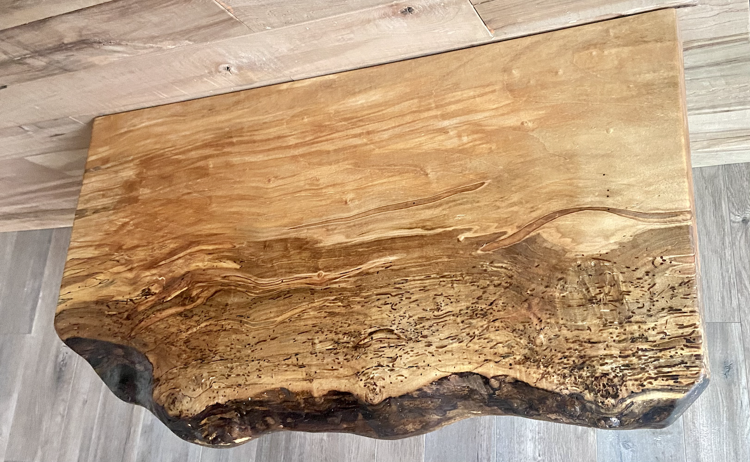 Handmade spalted hardwood vanity top with smooth finish and organic live edge front. Solid wood bathroom vanity top featuring spalted grain, knot detail, and natural character.